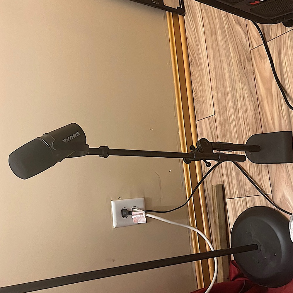 Shure microphone with cord and head phones and mic stand already attached